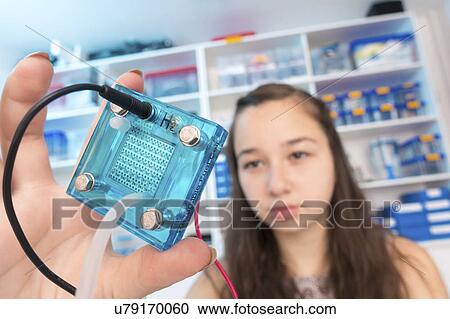 Girl testing proton exchange membrane cell View Large Photo Image Stock Image - Girl testing proton exchange membrane cell. Fotosearch