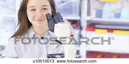 Girl using microscope View Large Photo Image Stock Image - Girl using microscope. Fotosearch