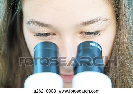 Girl using microscope View Large Photo Image Stock Image - Girl using microscope. Fotosearch
