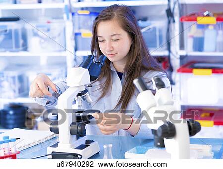 Girl using microscope View Large Photo Image Stock Image - Girl using microscope. Fotosearch