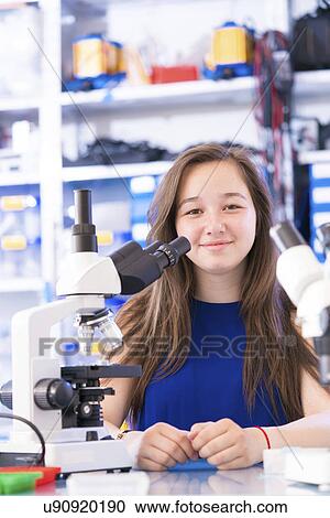 Girl with microscope View Large Photo Image Stock Image - Girl with microscope. Fotosearch