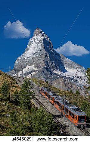 Stock Image - Gornergratbahn passenger train under Matterhorn, Zermatt, Canton Wallis, Switzerland. Fotosearch