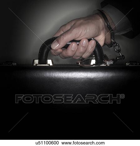 Hand connected to briefcase with handcuffs View Large Photo Image Stock Image - Hand connected to briefcase with handcuffs. Fotosearch
