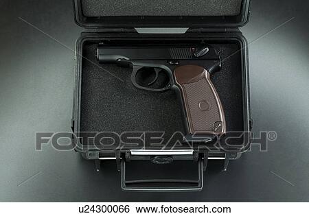 Handgun in a briefcase View Large Photo Image Stock Photograph - Handgun in a briefcase. Fotosearch