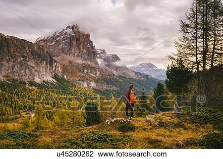 Hiker enjoying scenery, Mount Lagazuoi, Dolomite Alps, South Tyrol, Italy View Large Photo Image Stock Image - Hiker enjoying scenery, Mount Lagazuoi, Dolomite Alps, South Tyrol, Italy. Fotosearch