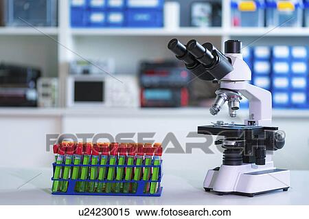 Stock Photography - Laboratory microscope and test tubes. Fotosearch