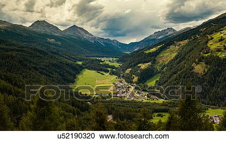 Stock Image - Landscape view of mountains and village in Vinschgau Valley, South Tyrol, Italy. Fotosearch