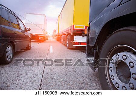 Stock Photo - Low angle view of rows of traffic queueing on highway. Fotosearch