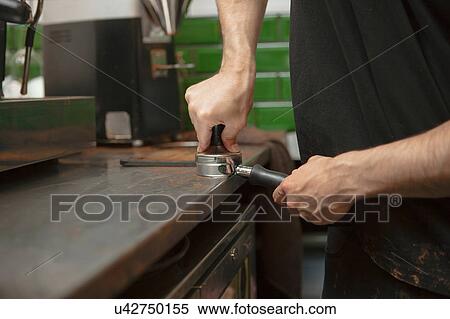Male barista's hands preparing coffee machine in cafe View Large Photo Image Stock Photography - Male barista's hands preparing coffee machine in cafe. Fotosearch