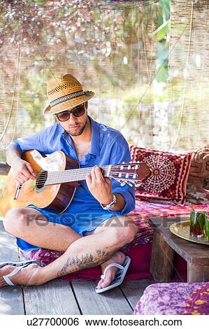 Stock Photograph - Man playing guitar. Fotosearch