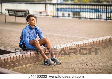 Man resting on pavement, Wapping, London, UK View Large Photo Image Stock Image - Man resting on pavement, Wapping, London, UK. Fotosearch