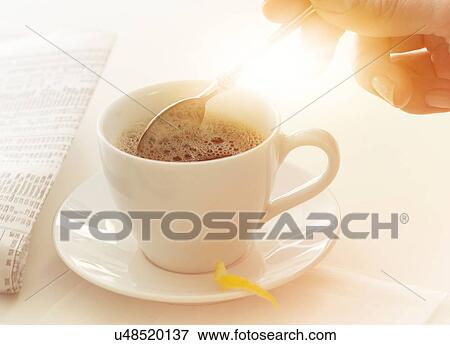 Man stirring coffee View Large Photo Image Stock Photo - Man stirring coffee. Fotosearch