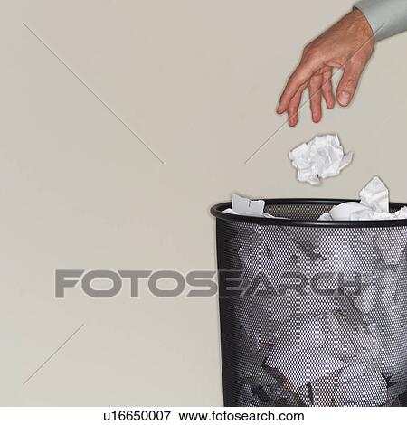Man throwing paper balls into wastepaper basket View Large Photo Image Stock Photo - Man throwing paper balls into wastepaper basket. Fotosearch