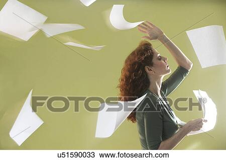 Mature woman scattering papers around herself View Large Photo Image Stock Image - Mature woman scattering papers around herself. Fotosearch