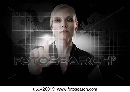 Mature woman touching virtual screen View Large Photo Image Stock Photo - Mature woman touching virtual screen. Fotosearch