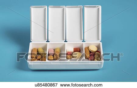 Medication dispenser View Large Photo Image Stock Photo - Medication dispenser. Fotosearch