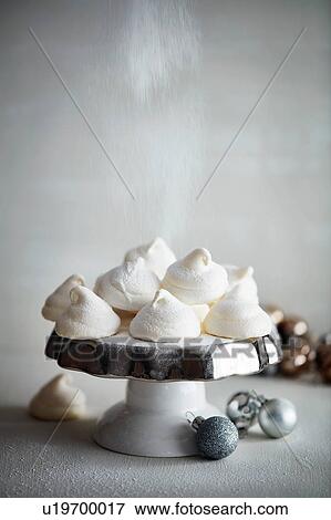 Meringues on cake stand and Christmas baubles View Large Photo Image Stock Photo - Meringues on cake stand and Christmas baubles. Fotosearch