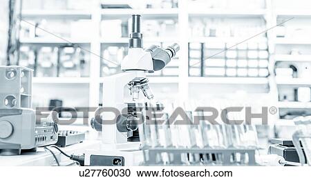 Stock Image - Microscope and test tubes. Fotosearch