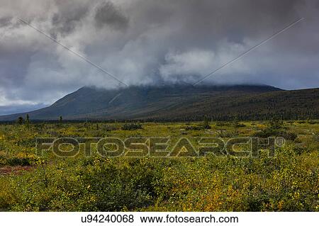 Stock Photo - Mountain, and clouds in Autumn, off Richardson Highway, Route 4, North of Paxon, Alaska. Fotosearch