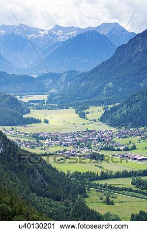 Stock Image - Mountains and small town, Switzerland. Fotosearch