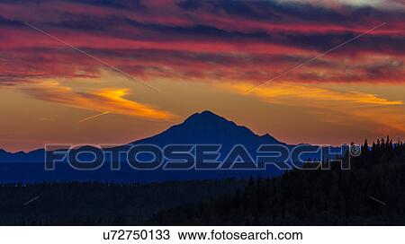 Stock Image - Mt Redoubt Volcano at Skilak Lake, Alaska, the Aleutian Mountain Range. Fotosearch