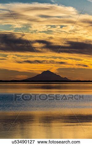Stock Photo - Mt Redoubt Volcano at Skilak Lake, Alaska, the Aleutian Mountain Range. Fotosearch