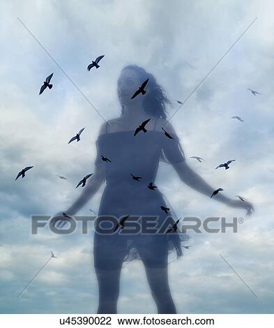 Stock Image - Multiple layered image of young woman against sky. Fotosearch