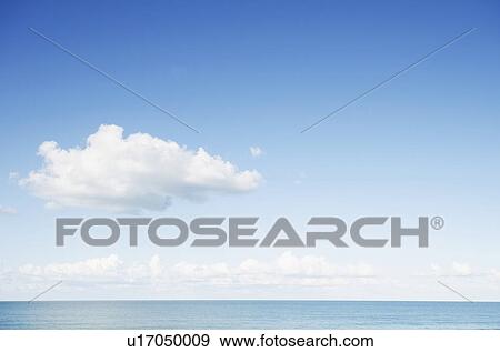 Stock Photo - North Carolina, Blue sky over sea. Fotosearch