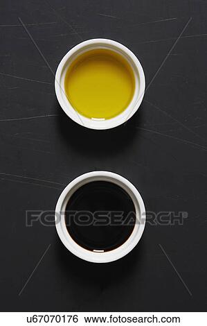 Stock Photograph - Olive oil and vinegar in bowls. Fotosearch