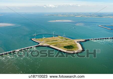 Oosterschelde flood barrier and wind turbines, Vrouwenpolder, Netherlands View Large Photo Image Stock Image - Oosterschelde flood barrier and wind turbines, Vrouwenpolder, Netherlands. Fotosearch