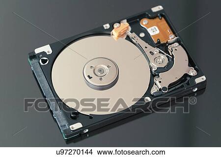 Open hard disc drive View Large Photo Image Picture - Open hard disc drive. Fotosearch