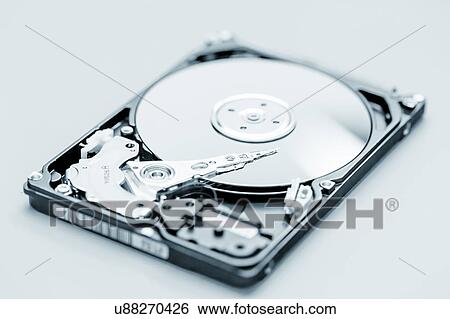 Open hard disc drive View Large Photo Image Stock Photograph - Open hard disc drive. Fotosearch