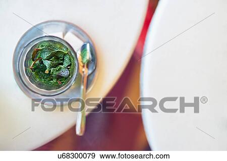 Stock Photo - Overhead view of a glass of mint tea, Marrakech, Morocco. Fotosearch