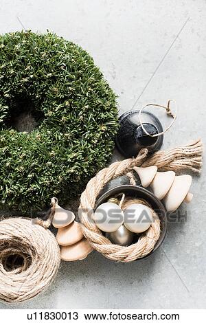 Stock Image - Overhead view of Christmas decorations with string and rope. Fotosearch