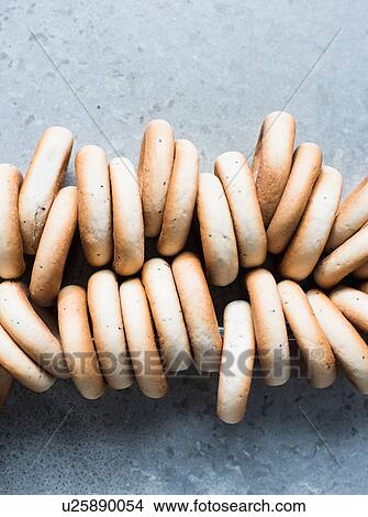 Picture - Overhead view of fresh bagels strung together. Fotosearch