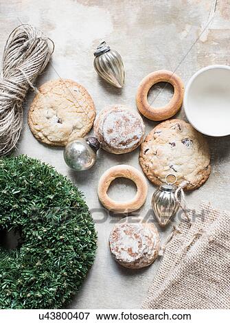 Overhead view of silver Christmas baubles and fresh cookies and bagels View Large Photo Image Stock Photo - Overhead view of silver Christmas baubles and fresh cookies and bagels. Fotosearch