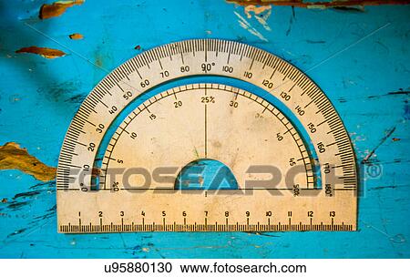 Overhead view of vintage protractor on blue table View Large Photo Image Stock Image - Overhead view of vintage protractor on blue table. Fotosearch