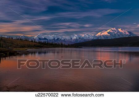 Stock Image - Panoramic view of Mount Denali, previously known as McKinley from Wonder Lake, Denali National Park, Alaska. Fotosearch