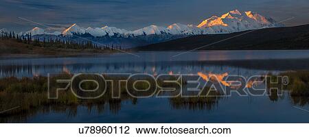 Stock Image - Panoramic view of Mount Denali, previously known as McKinley from Wonder Lake, Denali National Park, Alaska. Fotosearch