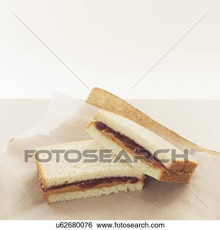 Peanut butter and jelly sandwiches on wrapping paper View Large Photo Image Stock Photograph - Peanut butter and jelly sandwiches on wrapping paper. Fotosearch