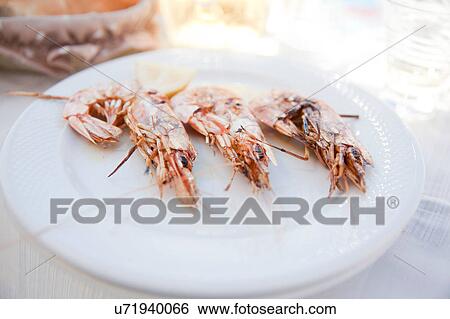 Stock Photograph - Plate of grilled prawns. Fotosearch
