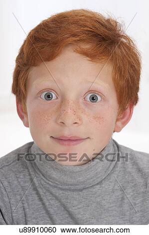 Stock Image - Portrait of a boy with red hair. Fotosearch