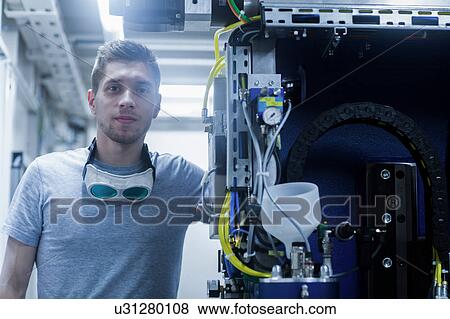 Stock Photo - Portrait of engineer in engineering plant. Fotosearch