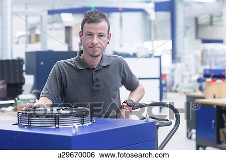Stock Photograph - Portrait of engineer in engineering plant. Fotosearch