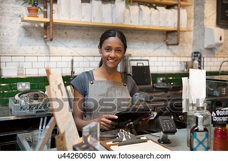 Portrait of female barista in cafe kitchen View Large Photo Image Stock Image - Portrait of female barista in cafe kitchen. Fotosearch