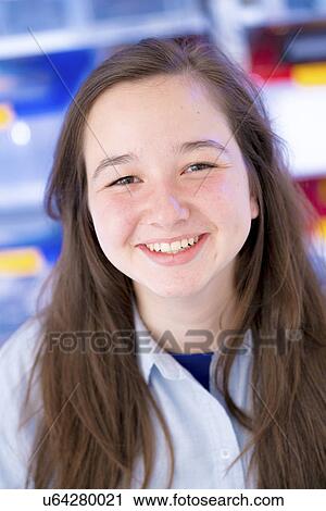 Portrait of girl with long brown hair, smiling View Large Photo Image Stock Image - Portrait of girl with long brown hair, smiling. Fotosearch