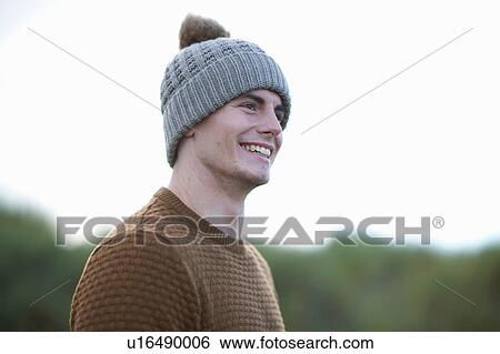 Portrait of happy man wearing beanie View Large Photo Image Stock Photograph - Portrait of happy man wearing beanie. Fotosearch