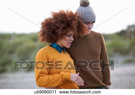 Stock Image - Portrait of loving multi-ethnic couple. Fotosearch