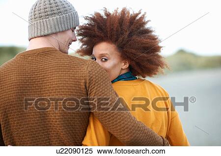 Stock Photography - Portrait of loving multi-ethnic couple. Fotosearch