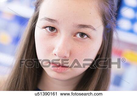Stock Image - Portrait of pensive girl. Fotosearch